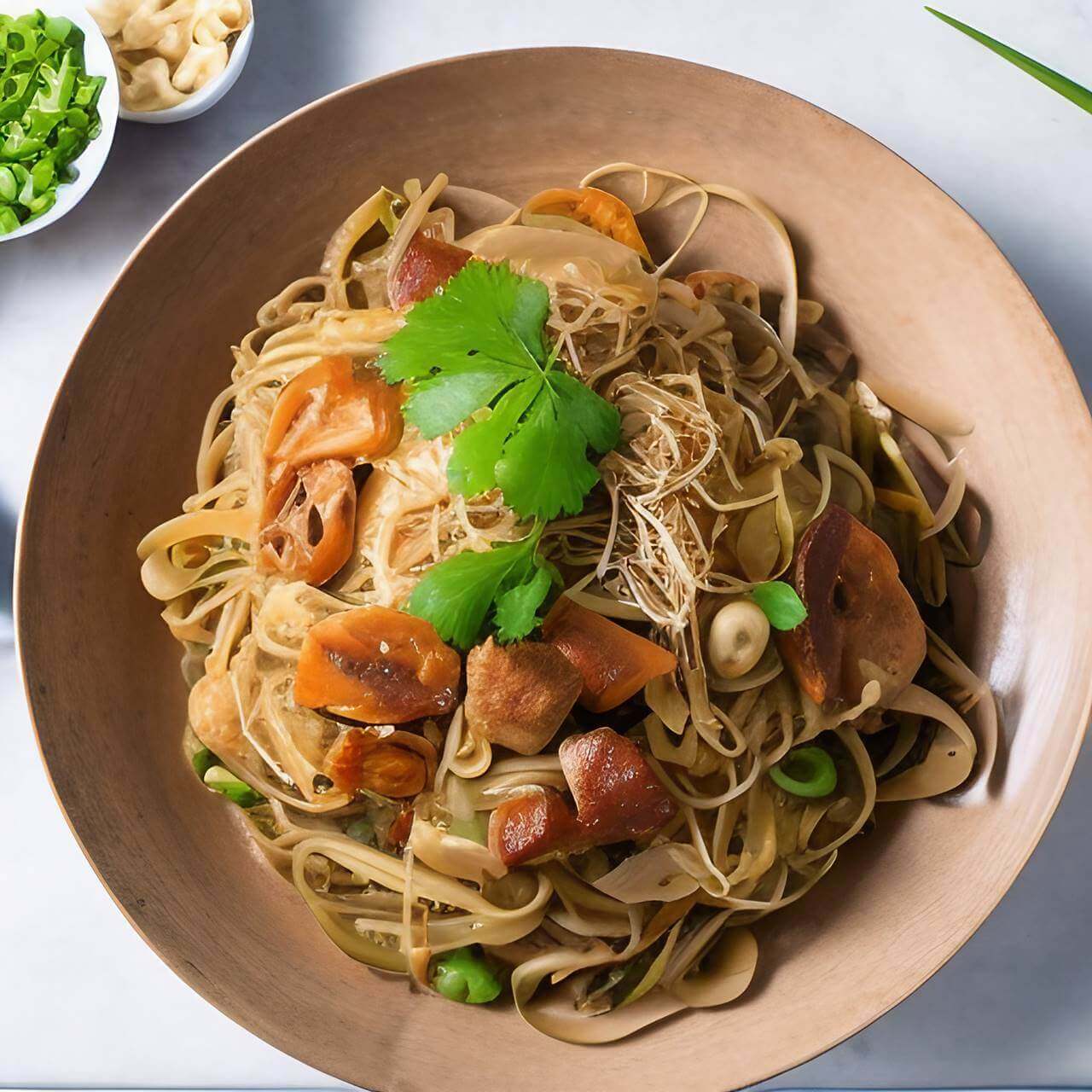 Pancit Bihon Guisado on brown bowl